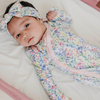Floral baby knotted gown with pink trim and snaps