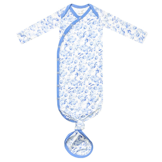 A baby long-sleeve sleep sack with a blue and white floral pattern, featuring blue trim and a matching tie-on bootie at the bottom, displayed on a solid white background.