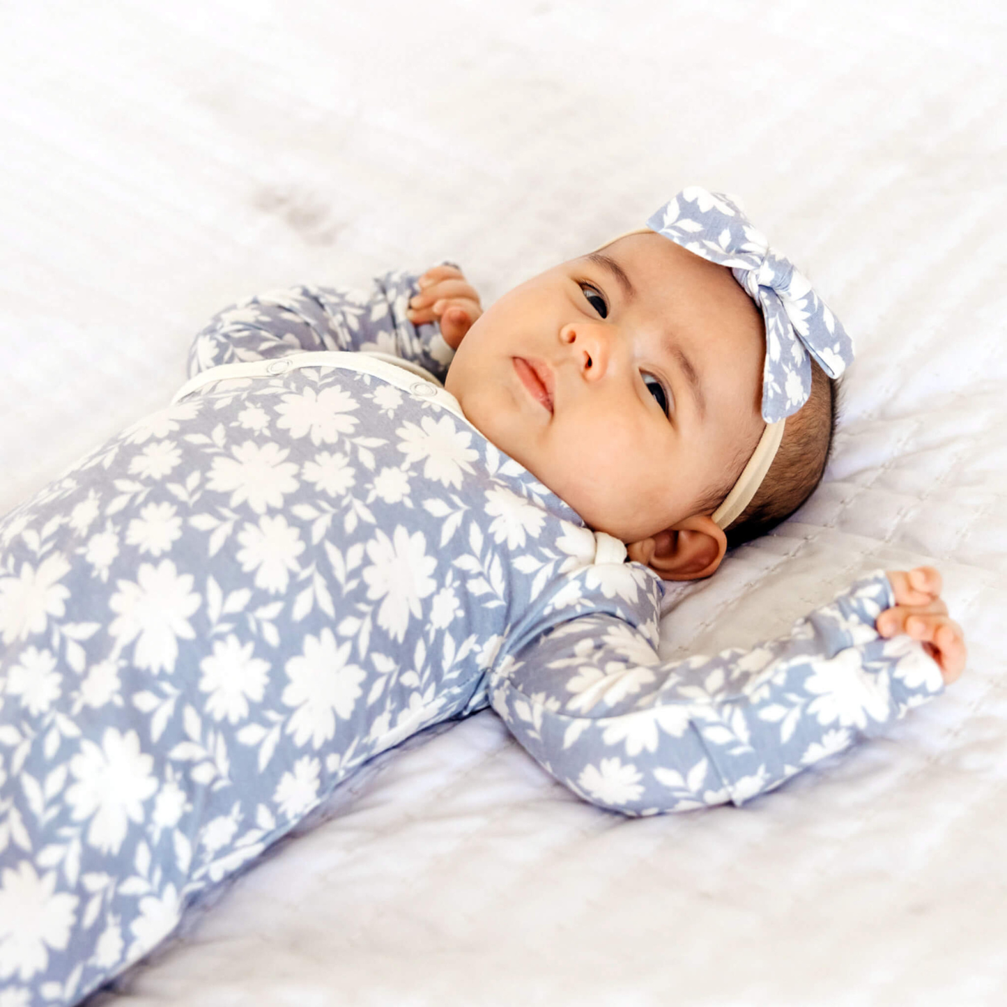 Lavender floral baby knotted gown with white trim