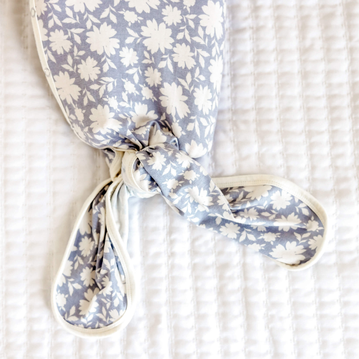 Lavender floral baby knotted gown with white trim