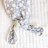 Lavender floral baby knotted gown with white trim