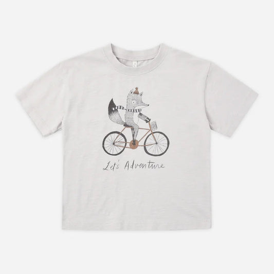 A light gray heathered short-sleeve t-shirt featuring a cartoon graphic of a fox riding a bicycle with the text 'Life Adventure' printed below, displayed flat against a light gray background.