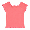Coral ribbed top with ruffled shoulders on a white background