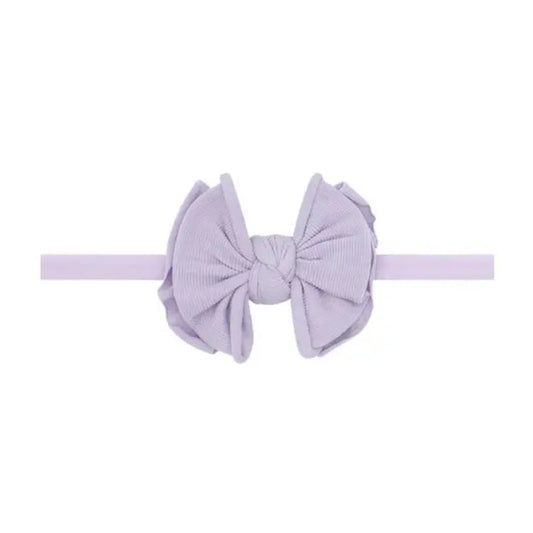 Light purple headband with bow in center