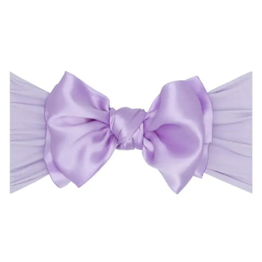 Lavender bow on a white background