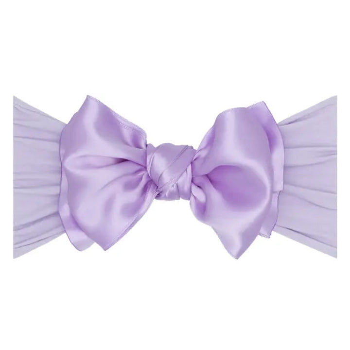 Lavender bow on a white background