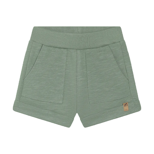 Green shorts with a small logo on a white background