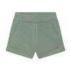 Green shorts with a small logo on a white background