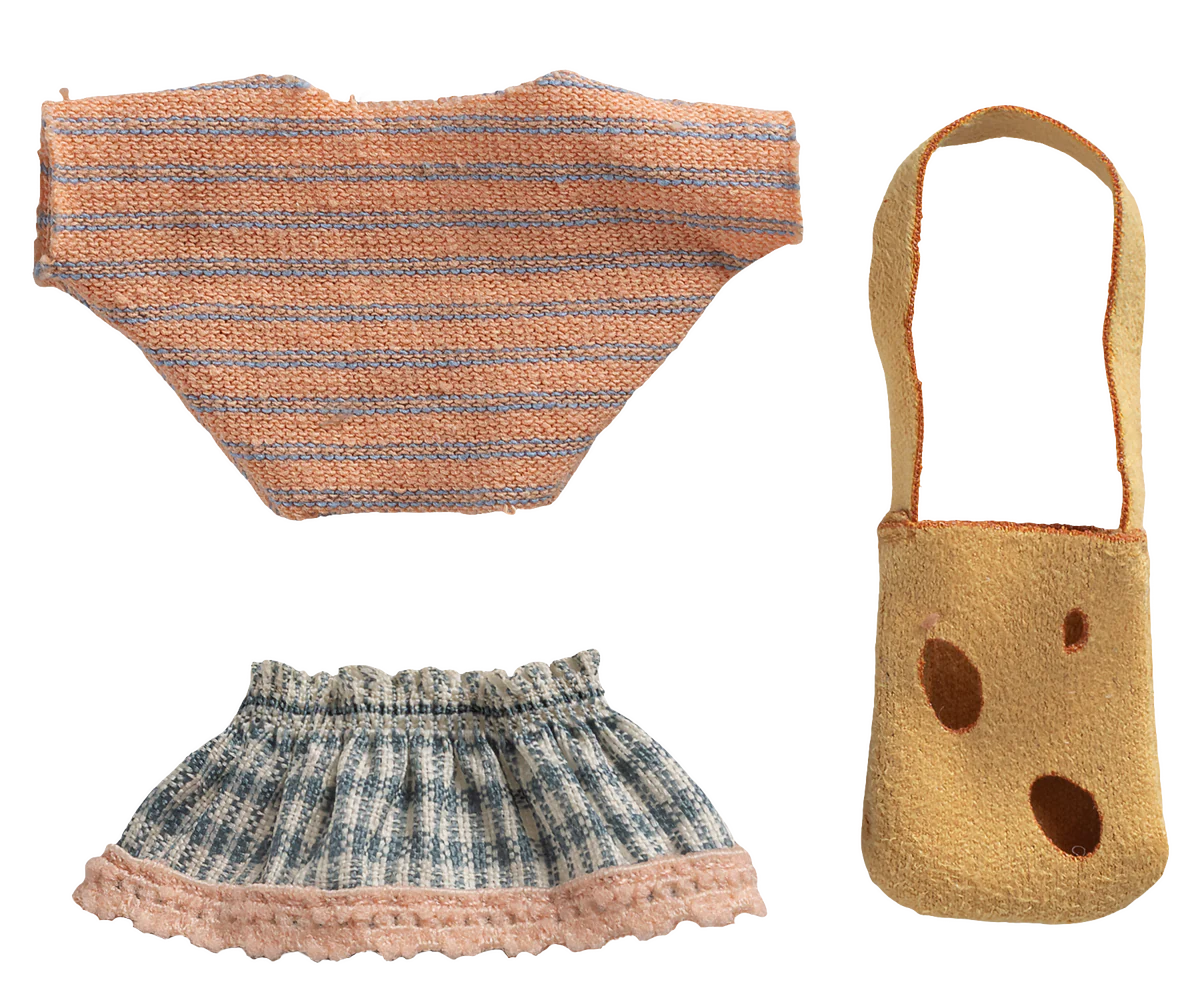 Knitted outfit with striped top, skirt, and bag on a white background
