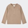 Beige long-sleeve shirt with a quarter zip on a white background