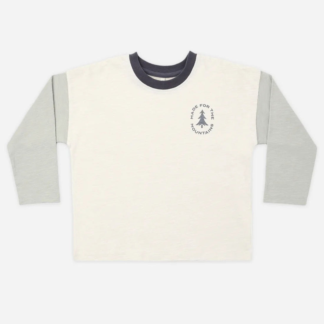 A long-sleeve ringer t-shirt in off-white with light gray sleeves and a dark navy collar, featuring a small circular chest graphic with a tree and the text 'The Pine Tree Company'.