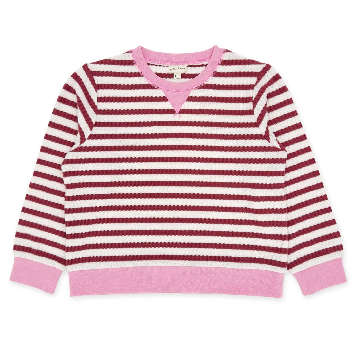 Pink and red striped sweater on a white background