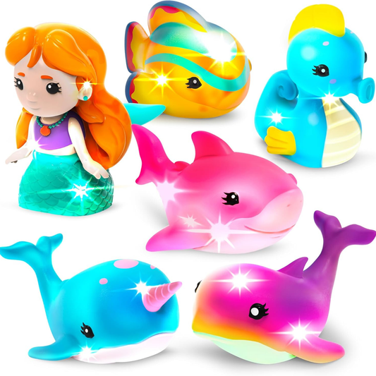 Colorful mermaid and sea creature bath toys on white background.