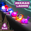Colorful mermaid and sea creature bath toys on white background.