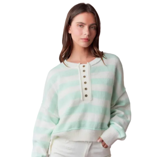Girl wearing a light mint and white striped sweater
