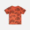 orange tee with monster truck graphic