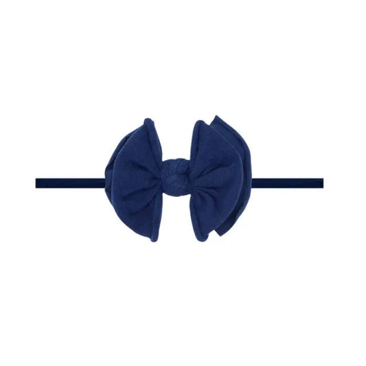 Navy blue headband with bow in the center