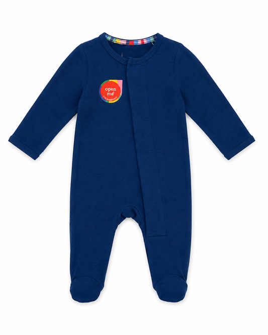 Navy blue baby onesie with colorful label on a white background