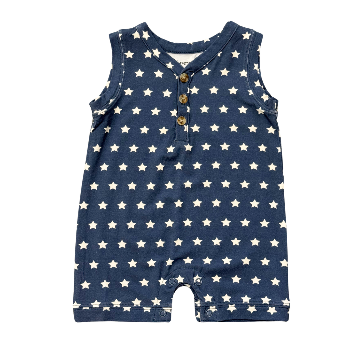 Navy blue romper with white star pattern on a white background