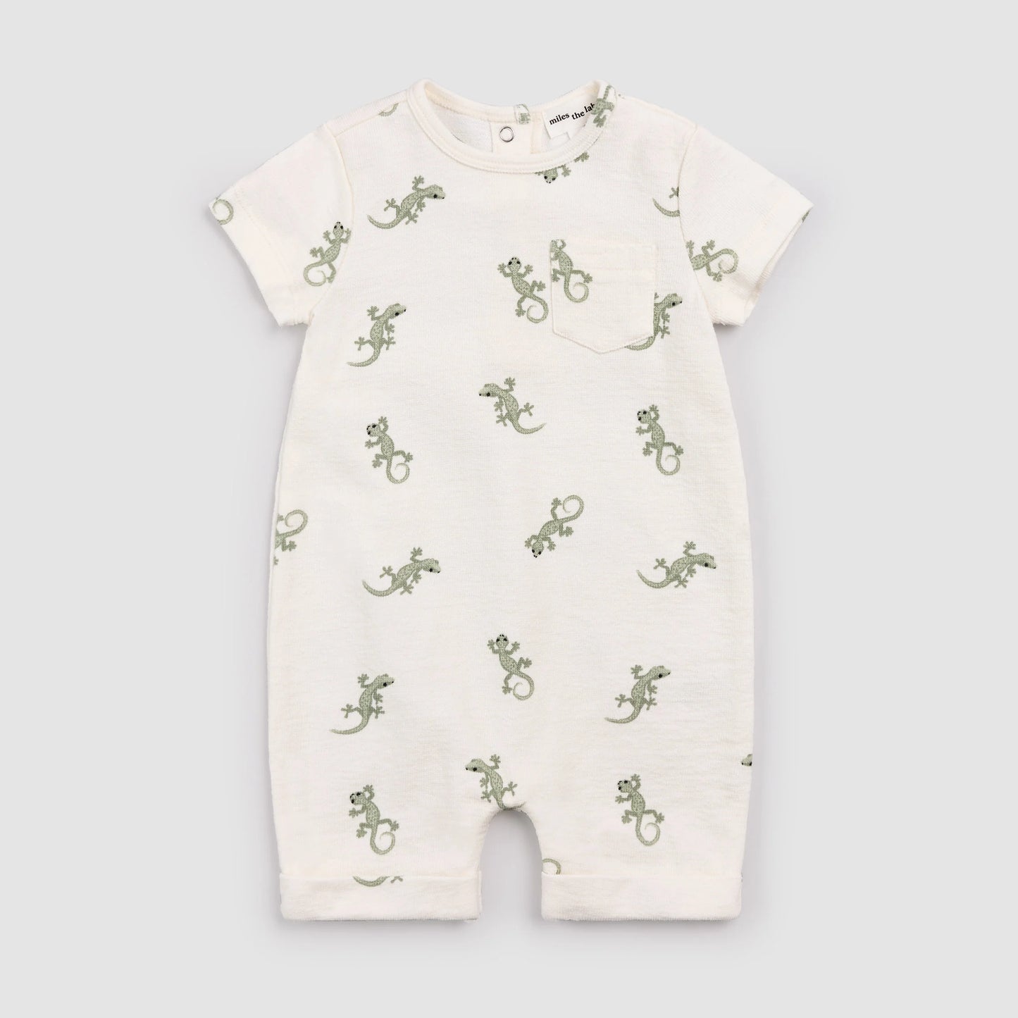 Baby romper with green lizard pattern