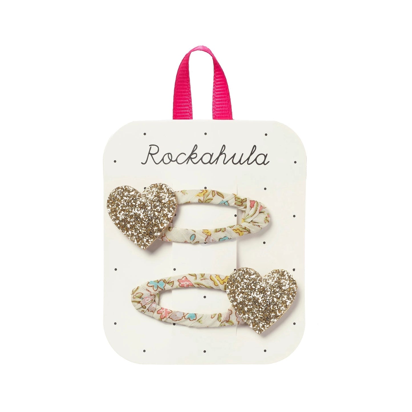 Heart-shaped hair clips on a Rockahula branded card with pink handle.