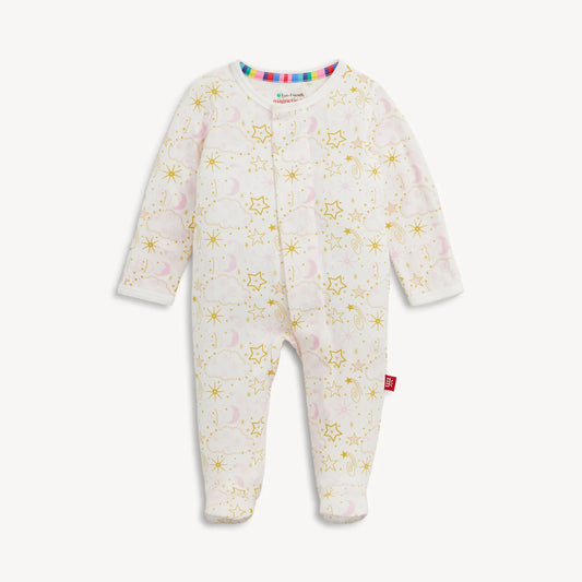 A baby footed sleeper featuring a white base with a gold star and moon pattern and a soft pink cloud motif.