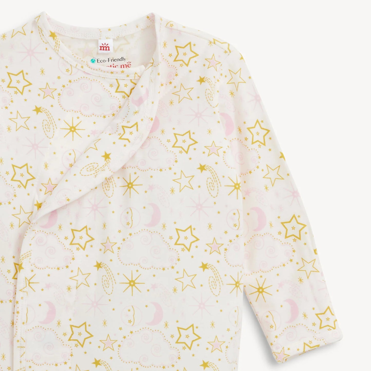 Close up of a pink and white baby gown with yellow star pattern.