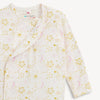 Close up of a pink and white baby gown with yellow star pattern.