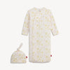 Pink and white baby gown and hat with yellow star pattern and matching hat.