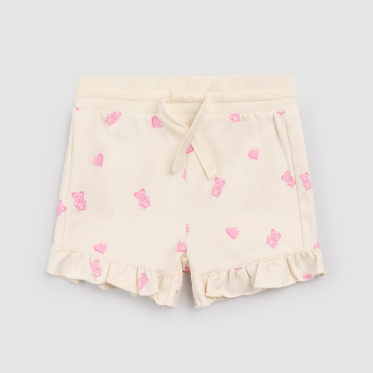 Cream shorts with pink gummy bears and heart patterns