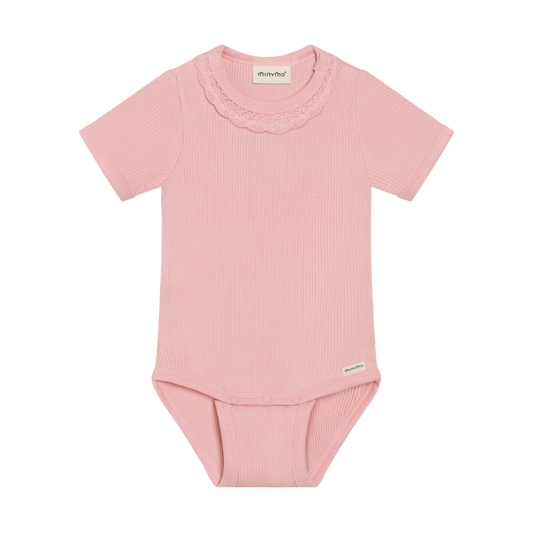 Pink baby bodysuit with ruffled collar on a white background
