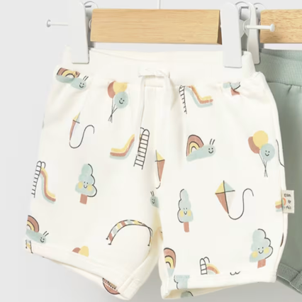 Baby knit shorts with a rainbow playground pattern