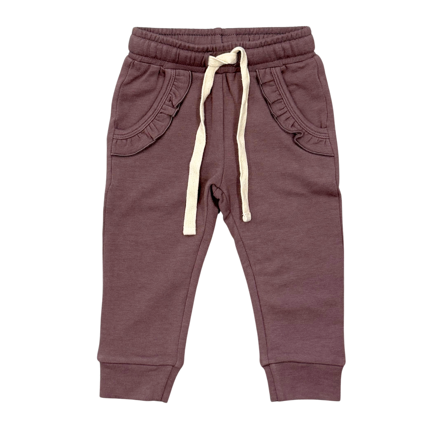 A pair of toddler jogger pants in a dusty plum purple color, featuring ruffle-trimmed front pockets and a cream-colored drawstring, shown against a plain white background.