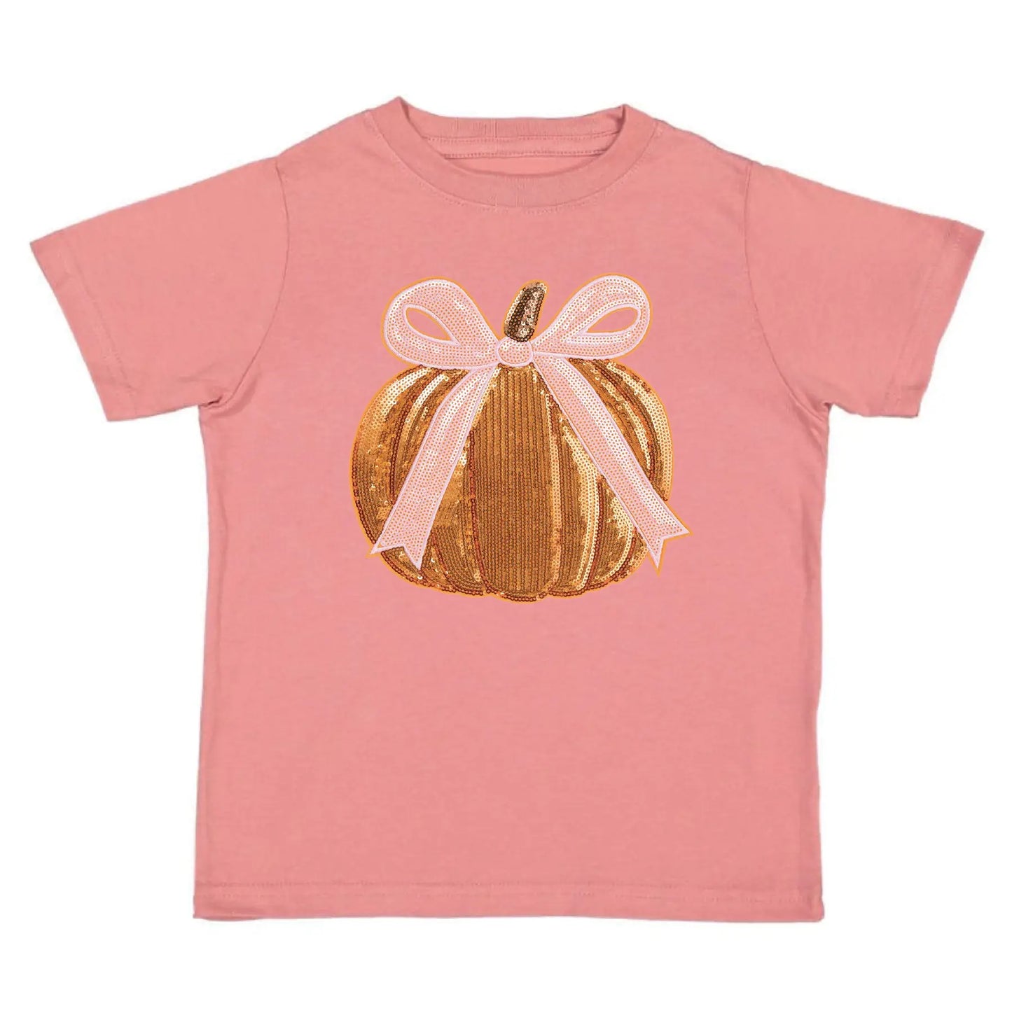 A pink short-sleeve kids' t-shirt featuring a graphic of a gold sequined pumpkin with a light pink ribbon bow on the front, set against a plain white background.