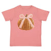 A pink short-sleeve kids' t-shirt featuring a graphic of a gold sequined pumpkin with a light pink ribbon bow on the front, set against a plain white background.