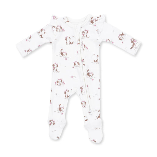 A white long-sleeve footed sleeper with a front zipper and an all-over print of brown and pink cartoon dogs, shown on a plain white background.