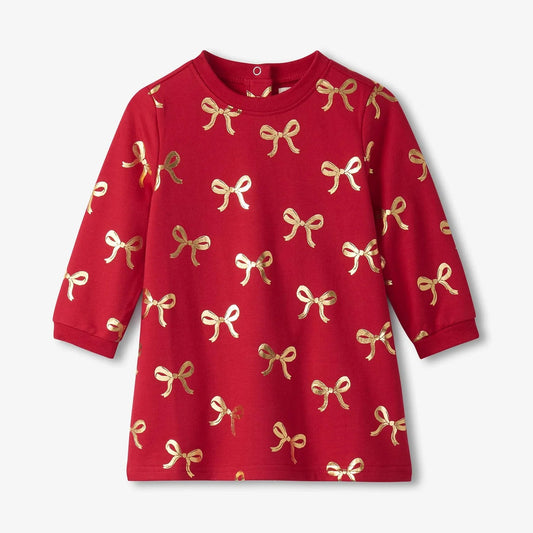 Red dress with gold bow pattern on a white background
