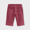 A pair of toddler's corduroy shorts in a dusty rose pink color, featuring an elastic waistband with two decorative buttons and two front patch pockets, shown flat on a light gray background.