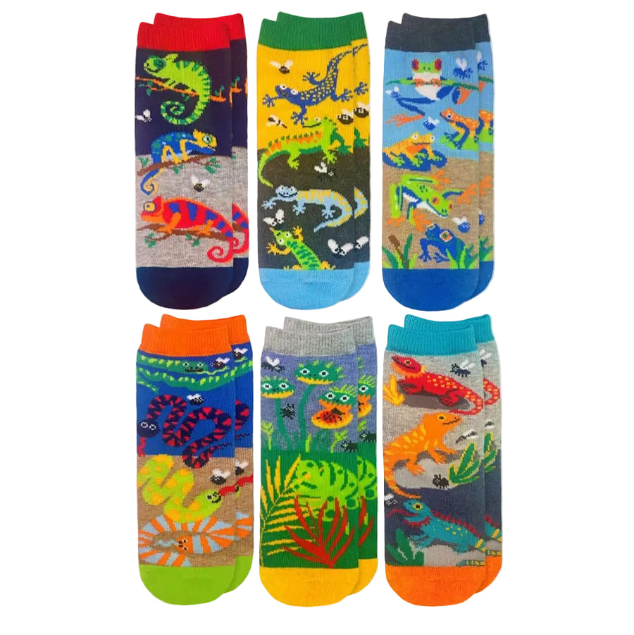 Six pairs of colorful socks arranged in two rows on a white background, each featuring a different vibrant reptile and prehistoric animal pattern.