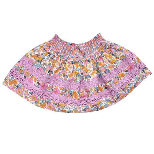Floral skirt with pink lace trim on a white background