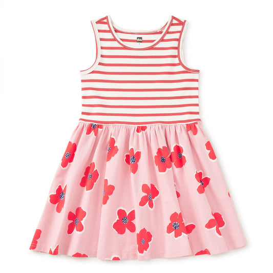 Pink dress with red floral pattern and white stripes on a white background
