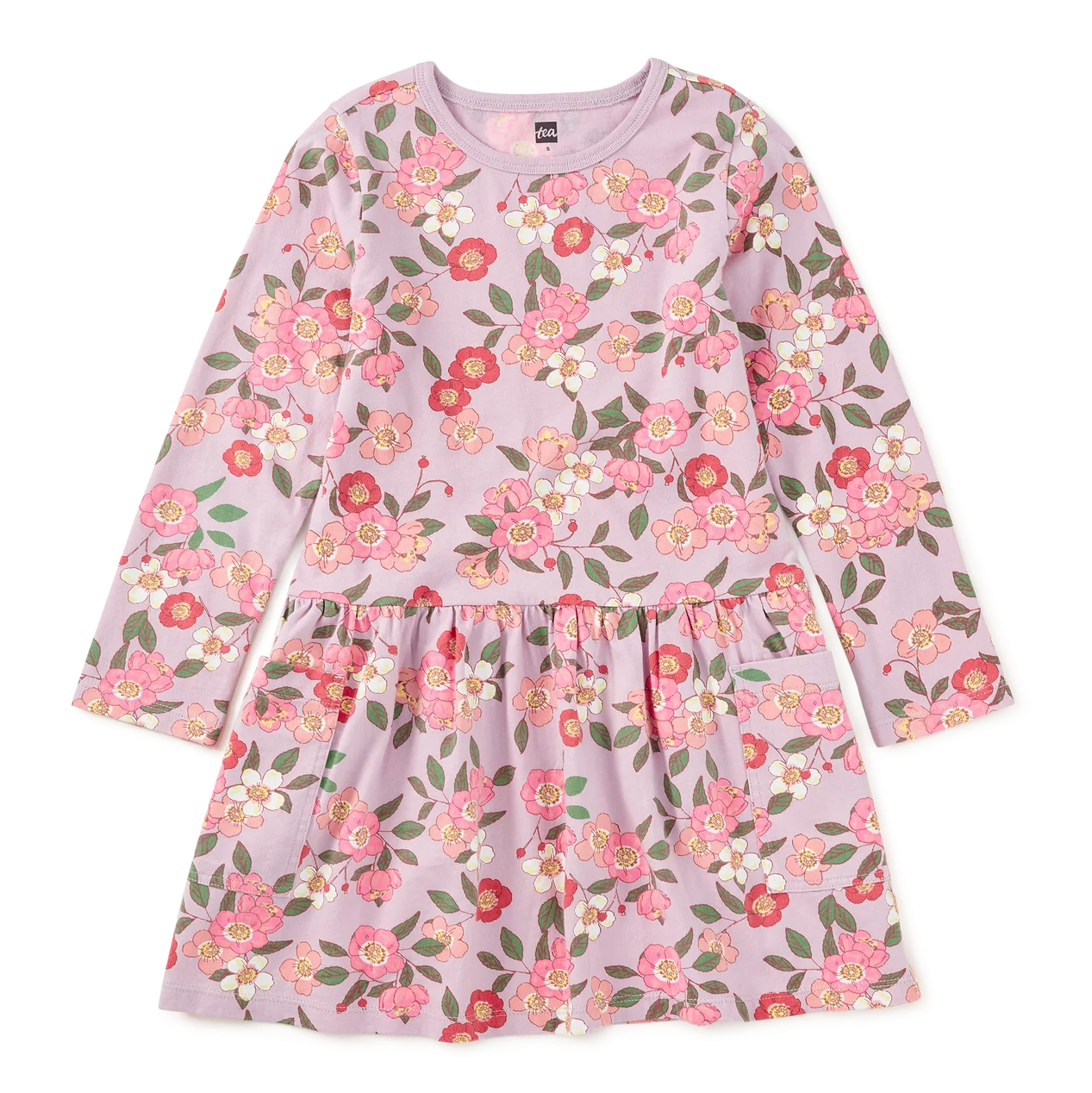 A long-sleeve children's dress in light pink with a dense floral print featuring pink, red, and green flowers with white highlights, displayed flat against a solid white background.