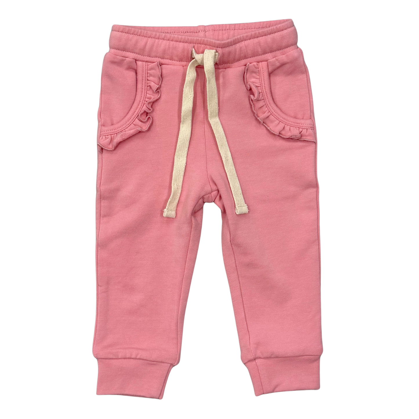 Pink toddler jogger pants with ruffled pocket edges, a cream drawstring, and ribbed ankle cuffs, shown flat on a white background.