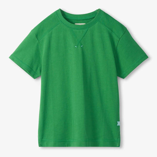 Green t-shirt on a light gray background