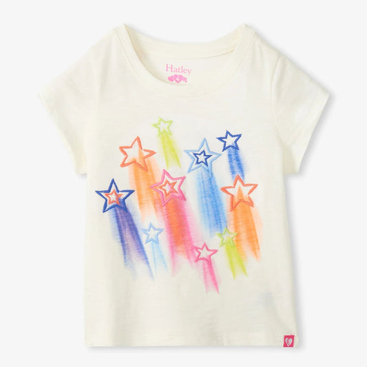 White t-shirt with colorful star designs on a white background