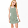 Young girl wearing a green dress on a white background