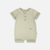 Sage ribbed romper with three natural colored buttons, and a cute pocket