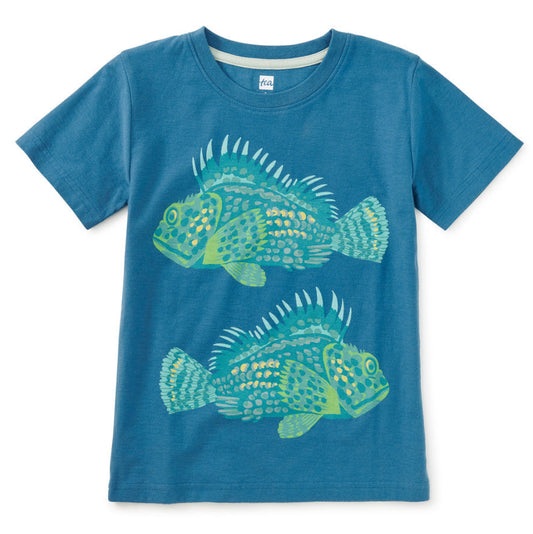 Blue t-shirt with fish design on a white background