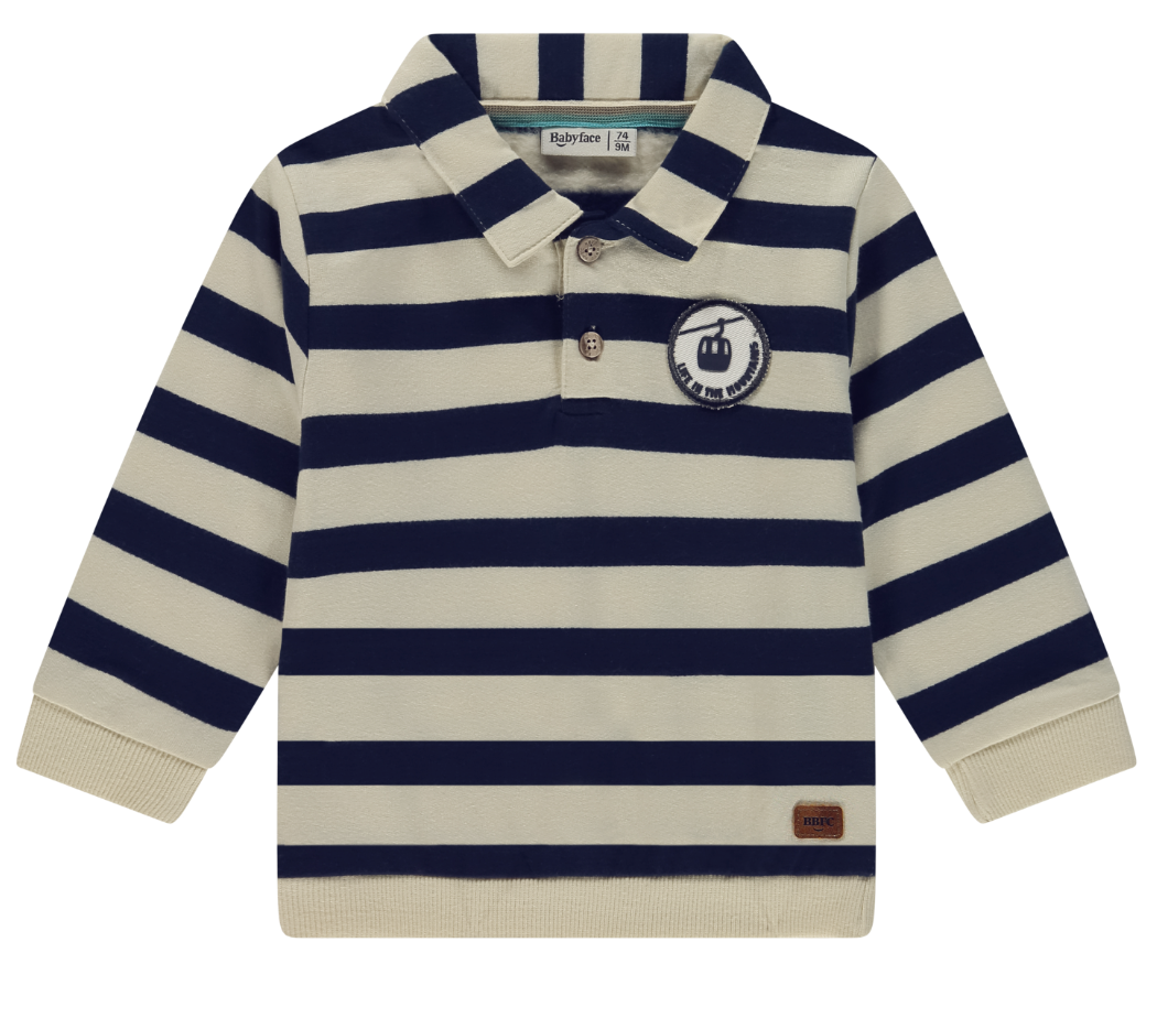 A striped collared top featuring navy and beige colors with a ski gondola patch on the chest.
