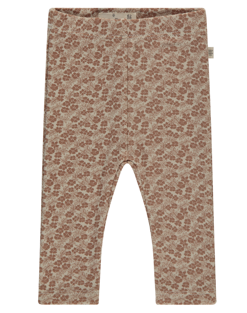 A pair of dusty rose colored leggings with a floral pattern.